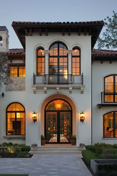 a large white house with lots of windows