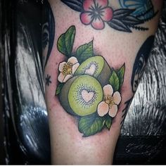 an apple with flowers and leaves on the leg