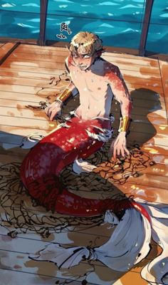 a man sitting on top of a wooden dock next to the ocean with a red mermaid tail