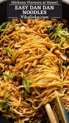 noodles and vegetables in a wok with chopsticks on the side, ready to be eaten