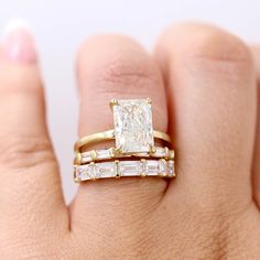 This timeless, sleek wedding band shows off five baguettes, held by heart-shaped prongs. She is pictured stacked with the Celeste ring and the Horizon wedding band, as well as the Serena ring and the Lauryn wedding band. Details: 14k white, yellow, or rose gold or platinum 1.75ct total carat weight— lab-grown diamonds or created emeralds *All diamonds are DEF color, VS1 clarity or better *Please note that colored gemstones may vary slightly in color. We do our best to accurately portray the colo Rose Gold Emerald Cut Engagement Ring, Mixed Metal Wedding Rings, Emerald Cut Wedding Band, Unique Wedding Bands For Women, Sleek Wedding, Fair Wedding, Baguette Diamond Wedding Band, Gold Emerald Ring, Baguette Wedding Band