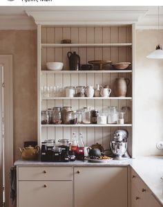 a kitchen filled with lots of dishes and cups