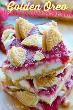 strawberry cheesecake bars stacked on top of each other with crackers in the middle