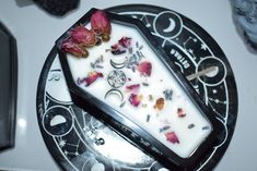 a piece of cake sitting on top of a black and white plate covered in flowers