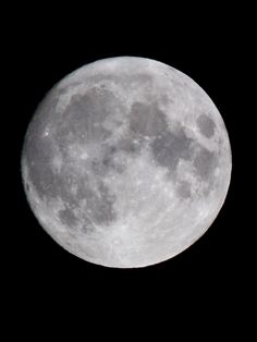 the full moon is seen in the dark sky