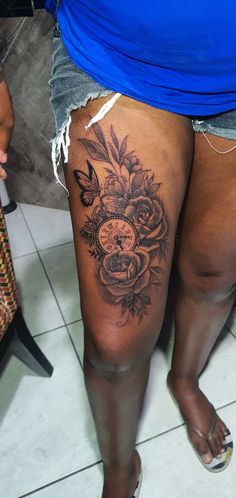 a woman's thigh with flowers on it