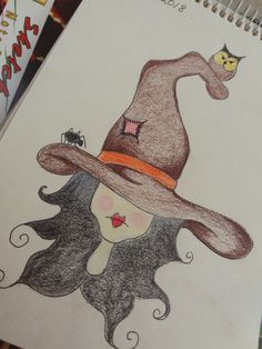 a drawing of a woman wearing a witches hat and holding a cat on her head