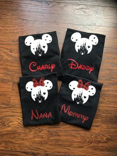 three mickey mouse napkins with the words happy, mama, and daddy on them