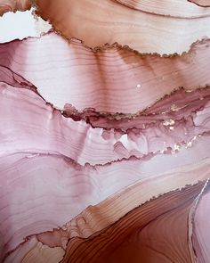 an abstract piece of art that looks like it has been painted in pink and gold