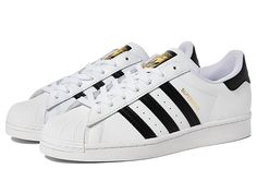 adidas Originals Superstar Foundation - Men's Classic Shoes : Footwear White/Core Black/Footwear White : A true classic, the adidas Originals Superstar Foundation sneakers keep it old school with iconic shell toes and logo detailing. For unisex sizing, please move two sizes larger for women's sizing. (E.G.: men's 3, women's 5) Low-top shoes with leather uppers and iconic 3-Stripes design. Lightly padded footbed for added comfort and support. Rubber toe cap and fat laces. Rubber outsole for great White Addis Shoes, Adidas Shoes White, White Adidas Superstar, White Adidas Shoes, Staple Sneakers, Adidas White Shoes, Pretty Sneakers, Black Footwear, Adidas Shoes Mens