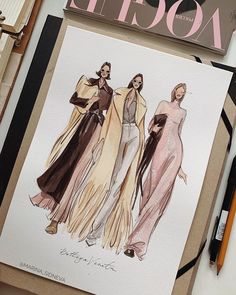 a drawing of three women in evening gowns next to a fashion magazine and scissors