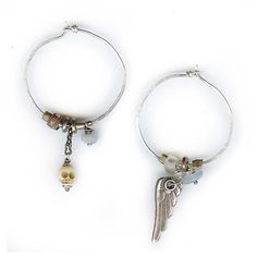 Sterling silver hoops accented with carved bone skull, aquamarine chips, trade beads and wing charm. Measures approximately 1.5" in diameter. Mismatch Earrings, Skull Wings, Found Object Jewelry, Carved Bone, Mismatched Earrings, Bone Carving, Trade Beads, Sterling Silver Hoops, Bohemian Chic