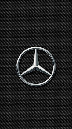 the mercedes logo is shown on a black carbon fiber wallpaper with white stitching