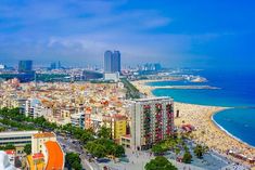 an aerial view of the beach and ocean in barcelona, spain on a sunny day