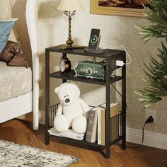 a teddy bear sitting on top of a shelf next to a bed