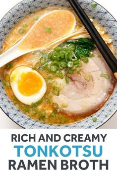 a bowl of ramen soup with an egg and two chopsticks in it