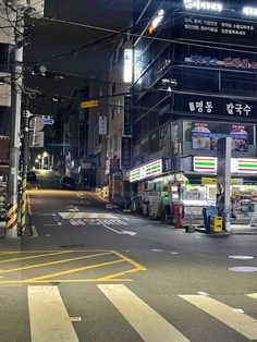 an empty city street at night with no traffic