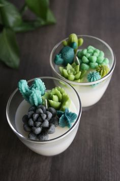 two glass bowls filled with different colored flowers on top of a table next to each other