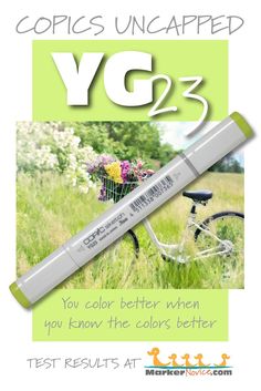 a white marker with the words yg2 written on it and a bicycle in the background