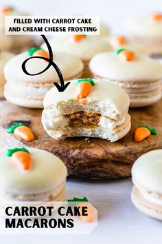 carrot cake macarons with carrots and cream cheese frosting are on a cutting board