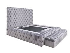 an upholstered bed is shown with the mattress on it's back end