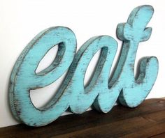 Love the wooden, but we don't have a scroll saw, so I may get B to cut me one out of metal. I think it'll look more vintage anyway. Eat Kitchen Sign, Wood Kitchen Signs, House Tweaking, Jigsaw Projects, Diner Sign, Eat Sign, Vintage Style Kitchen, Kitchen Words