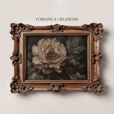 a painting hanging on the wall in front of a white wall with an ornate frame