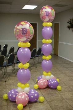 balloons are arranged in the shape of an x on a dancefloored floor