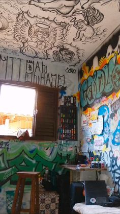 a room with graffiti all over the walls