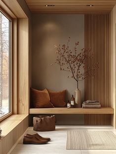 a wooden bench sitting next to a window filled with lots of pillows and vases