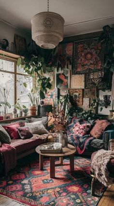 a living room filled with lots of furniture and plants