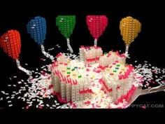 the cake is made out of legos and sprinkles