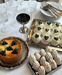 there are many desserts on the table ready to be eaten at this party or celebration