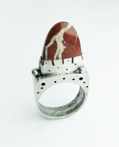 This is a real statement piece! The stone is a beautiful  red jasper in a tongue  shape. The ring is a hollowform so it's not heavy. Both sides are detailed and textured different. This ring reminds me of Mount Sinai. I use recycled sterling silver.  Includes shipping insurance for US addresses  For other countries please contact me for charges for insurance. Wear your art! Hollow Form Ring, Red Jasper Ring, Unique Jasper Rings For Gift, Red Jasper Crystal Ring, Unique Silver Jasper Necklaces, Unique Silver Jasper Necklace, Luxury Unique Jasper Jewelry, Mount Sinai, Art Jewelry Earrings