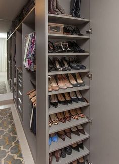 the closet is full of many pairs of shoes