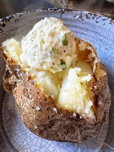 a close up of a baked potato on a plate