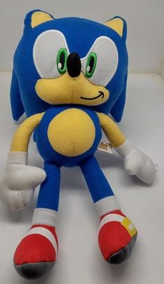 sonic the hedge plush toy sitting on a white surface