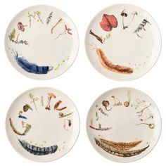 four plates with different designs on them