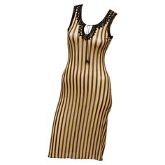 Jean Paul Gaultier Maille 90's Brown and Cream Stripe Sleeveless Dress in the iconic JPG stretch mesh. Black trim details along neckline and sleeve opening. Front neckline has a string and bead tie closure. Made in Italy Size; Medium , Measurements ; Shoulder 12' ; Bust 26" ; Waist 22" ; Hip 27" ; Shoulder to hem 40.4" ; Hem Opening 37" Striped Outfit, Vintage Jean Paul Gaultier, Dresses 90s, Jean Paul Gaultier Dress, Jean Paul Gaultier Stripes, Vintage Jean Paul Gaultier Most Revealing Dress, Vintage Jean Paul Gaultier Skirt, Tie Sleeve Dress, Fur Dress