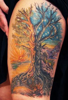 a man with a tree tattoo on his thigh