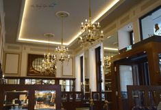 a chandelier hanging from the ceiling in a room