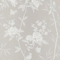 the wallpaper has white flowers on it and is painted in grey with white trim