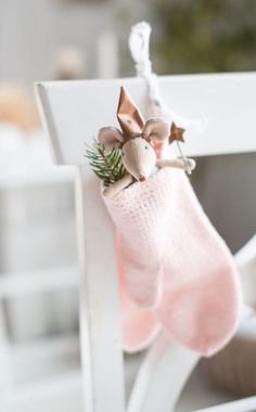 a pink stocking hanging from a white chair