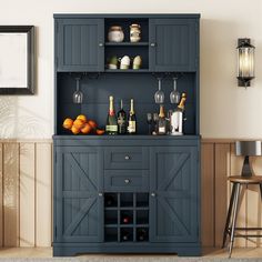 a blue cabinet with bottles and glasses on it