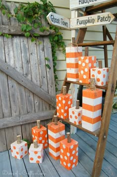 many orange and white boxes on a wooden table