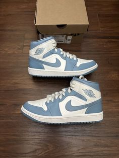 Elevate your sneaker game with these Nike Air Jordan 1 Mid Women's University Blue BQ6472-141 sneakers. These shoes feature a mid-top silhouette, making them perfect for both casual and athletic wear. The sail/sail/worn blue colorway adds a pop of color to any outfit, while the women's size 8W ensures a comfortable fit. Crafted with quality materials, these Air Jordan 1 sneakers are refurbished and ready for use. The style code BQ6472-141 and model name Air Jordan 1 confirm the authenticity of the product. These sneakers are a must-have for any sneakerhead looking to expand their collection. Cute Jordan 1, Jordan 1 Mid University Blue, Air Jordan 1 Mid Women, Jordan 1 Mid Women, Cute Jordans, Jordan 1 Mids, Jordan 1 Sneakers, Nike Air Jordan 1 Mid, Sneaker Games