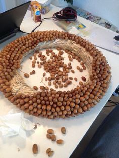 a bunch of nuts that are on top of a white table with plastic wrap around them