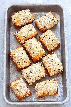 sesame seed squares on a baking sheet