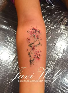 a woman's thigh with flowers on it and the words, camera roll 1381