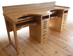 a wooden desk sitting on top of a hard wood floor